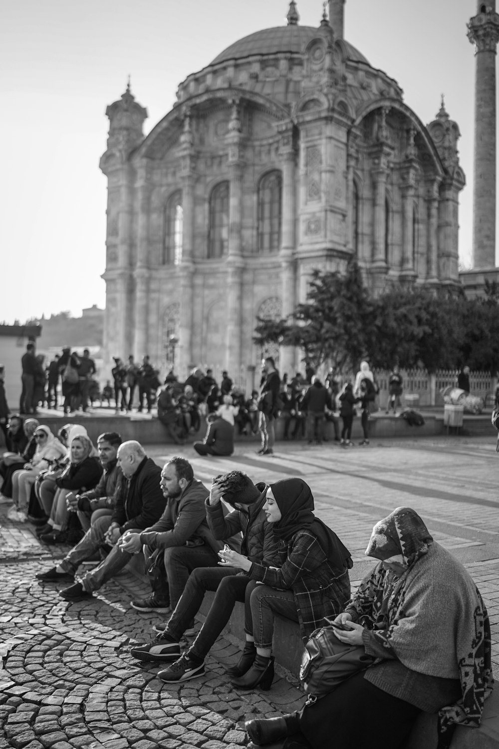 grayscale photography of people near cathedral