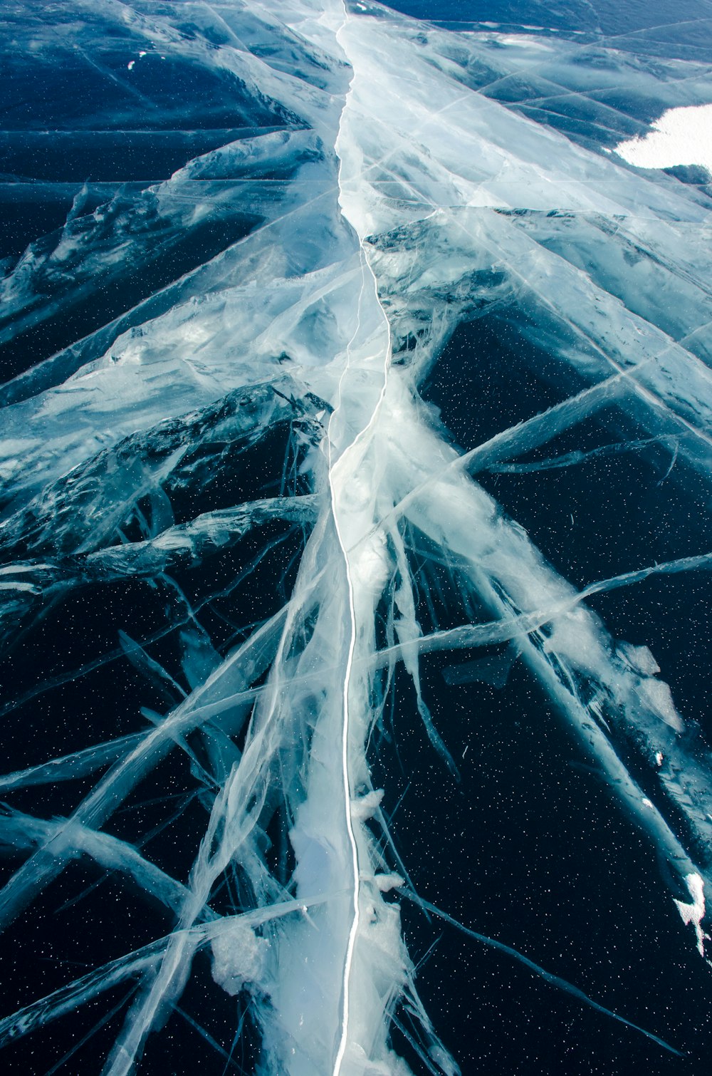 an aerial view of the water and ice