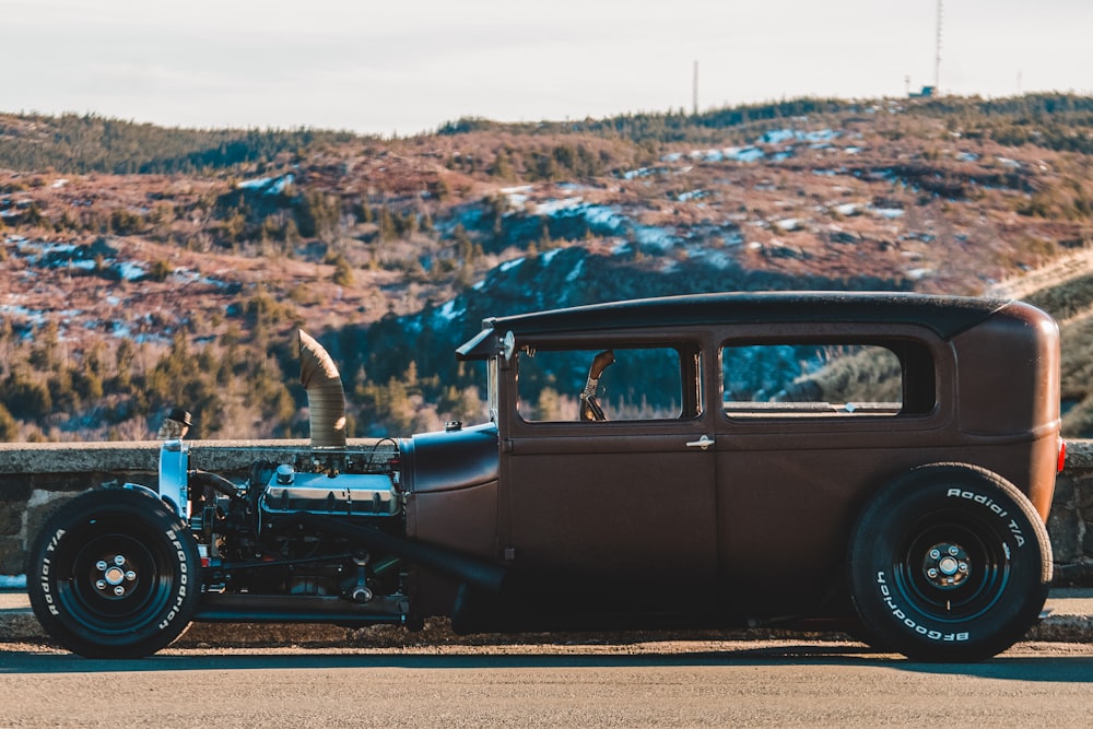 brown classic vehicle on road during daytime