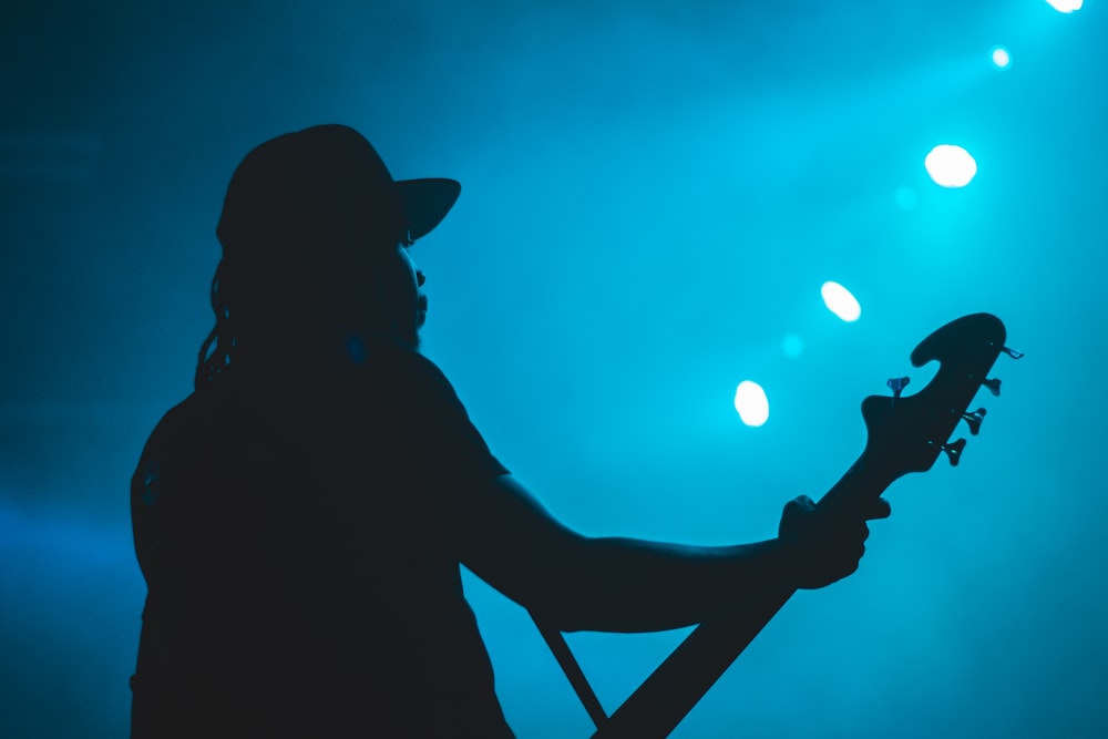 silhouette of man with guitar