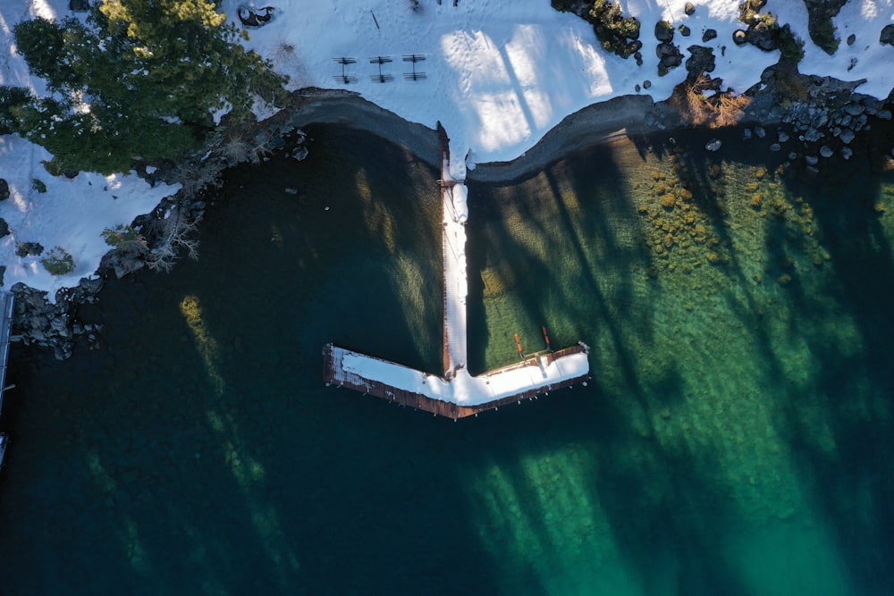 an aerial view of a boat dock in a lake