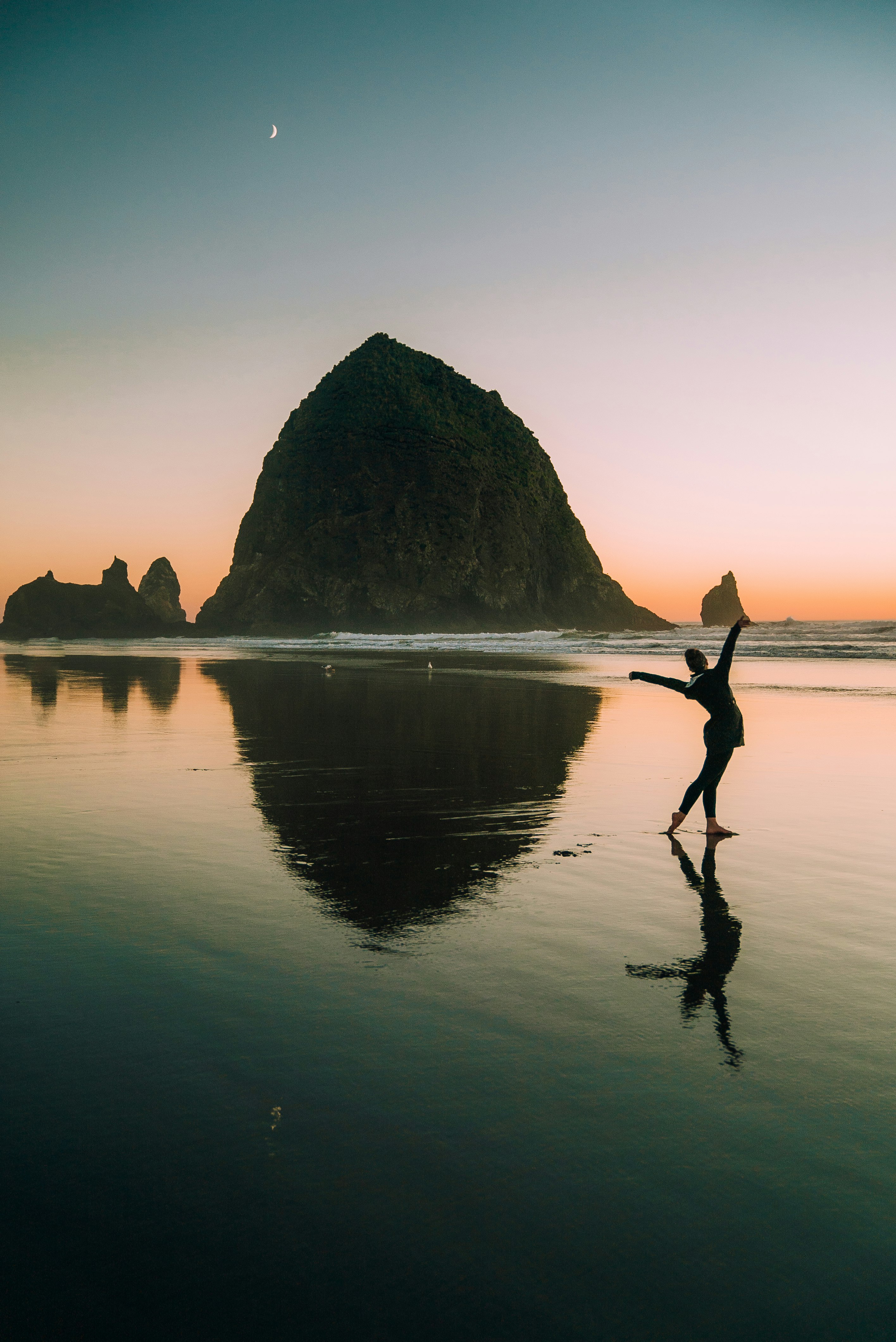 On a beautiful night along the pacific coast, we caught the sunset at Canon Beach, Oregon. With the water receding, a beautiful reflection was caught.