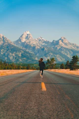 woman walking on road during daytime