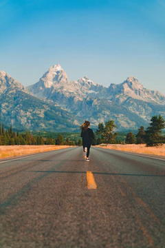 woman walking on road during daytime