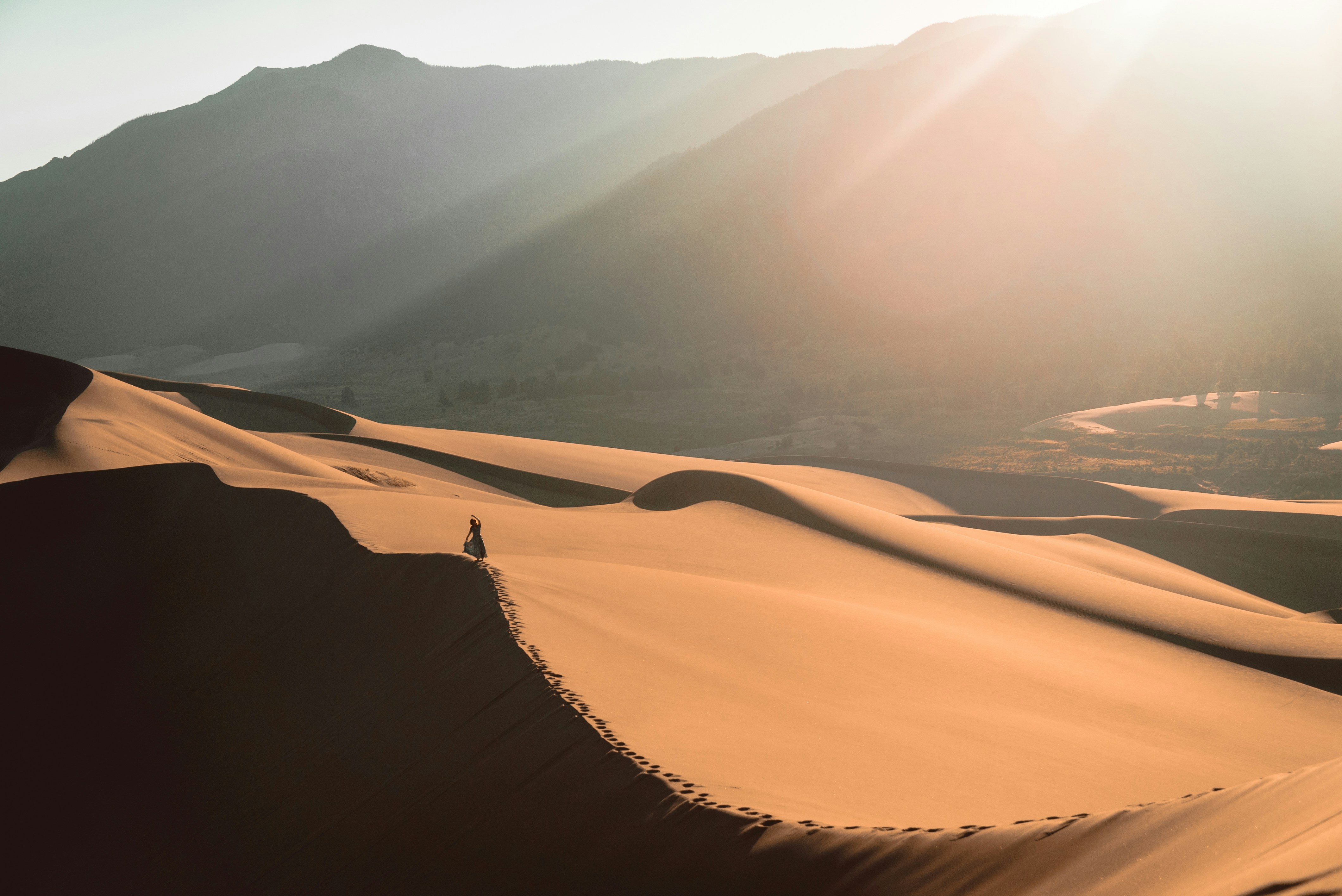 Hiking in the Great Sand Dunes National Park the morning light covered the dunes for miles to come.