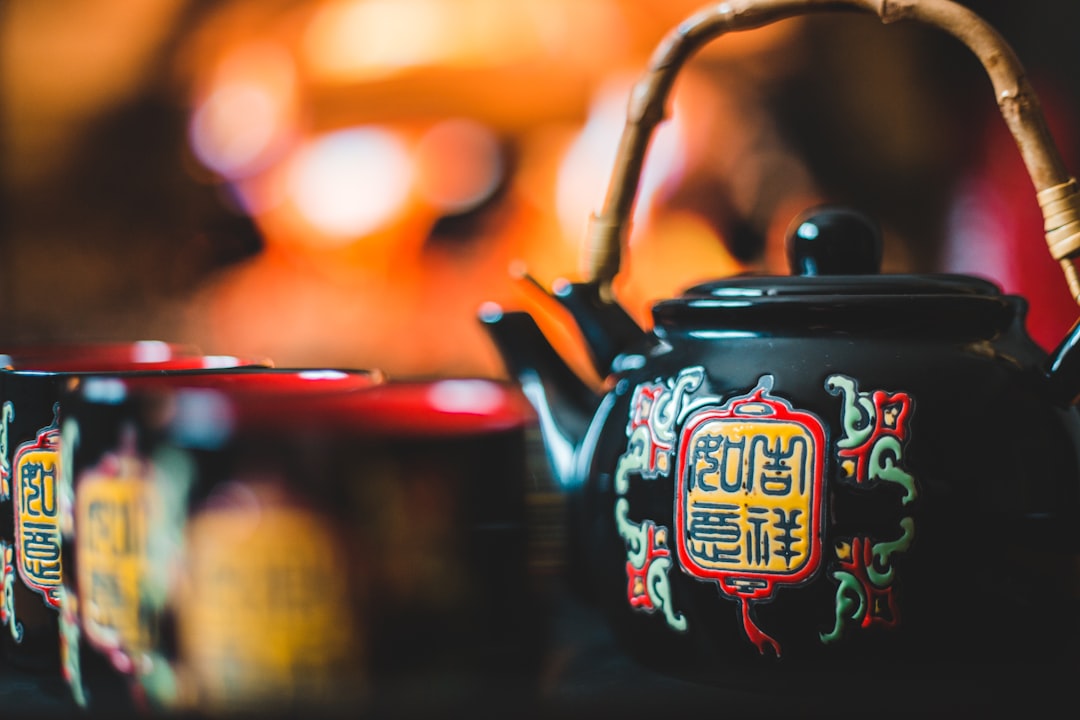 black ceramic teapot and cups