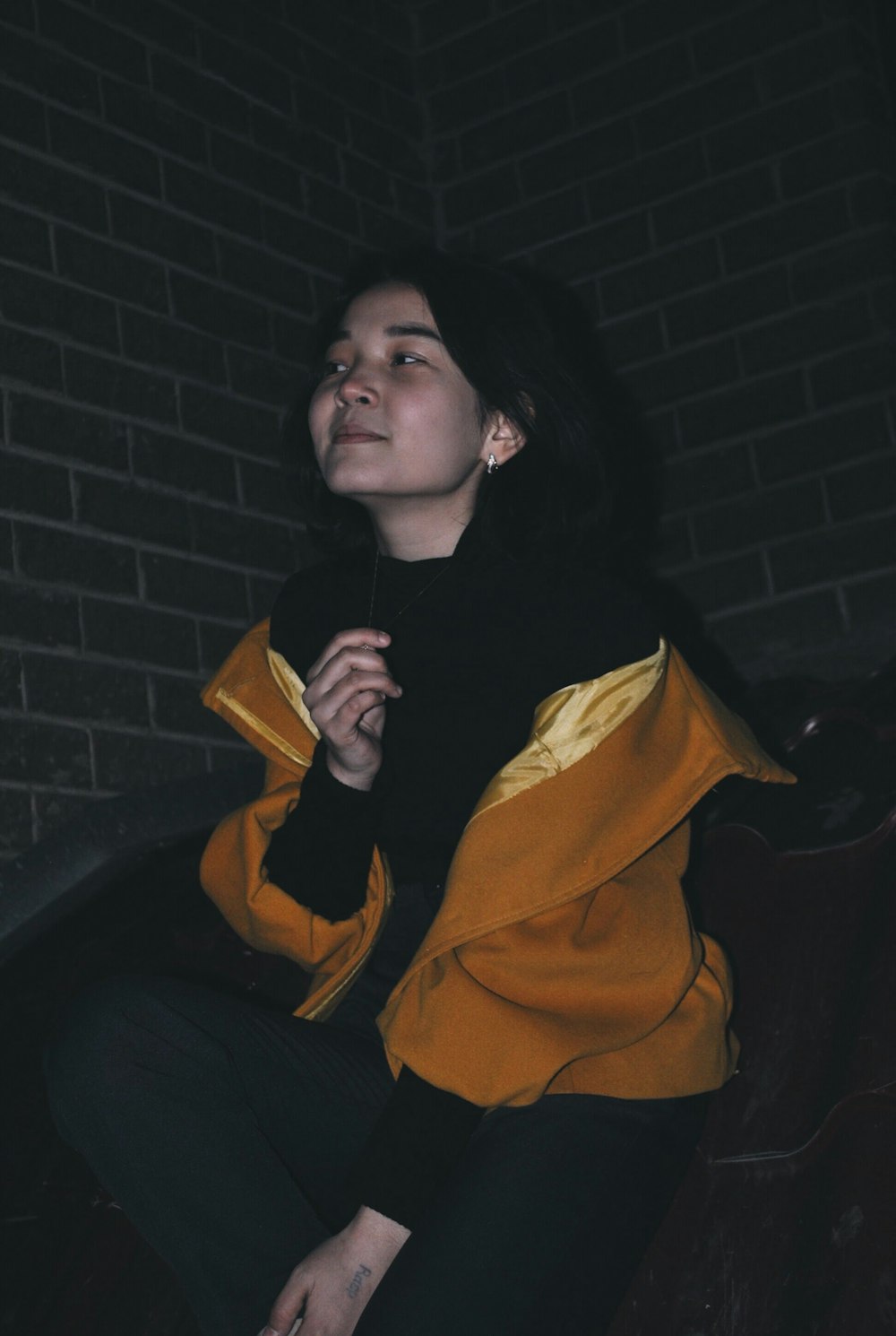 woman wearing yellow jacket