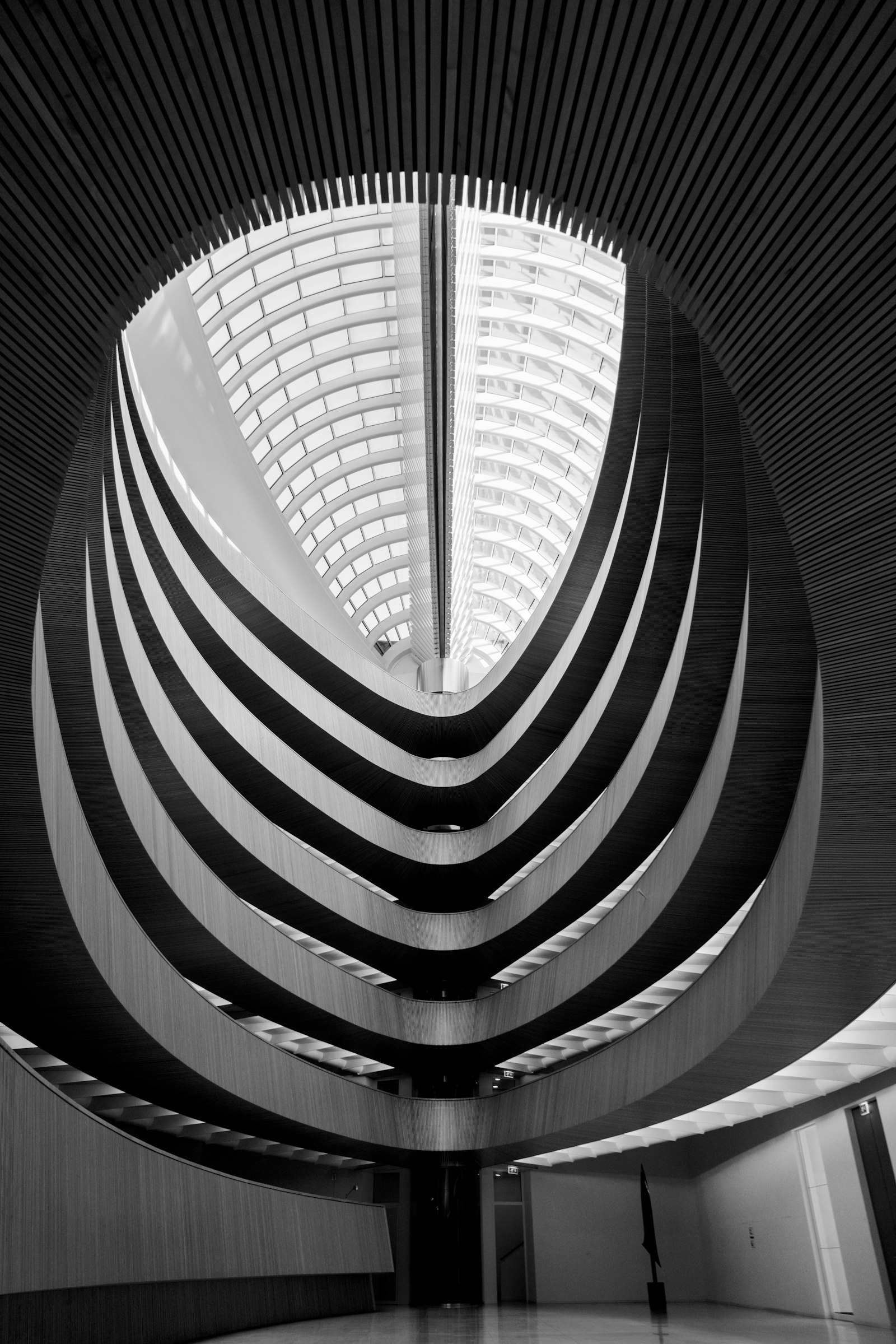 Grayscale photo of concrete building interior