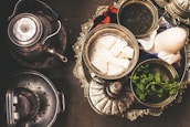 Assorted teas and snacks arranged on a rustic tray.