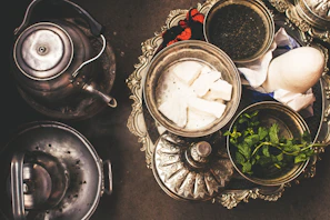 Butler preparing a personalized welcome tray with Moroccan tea.