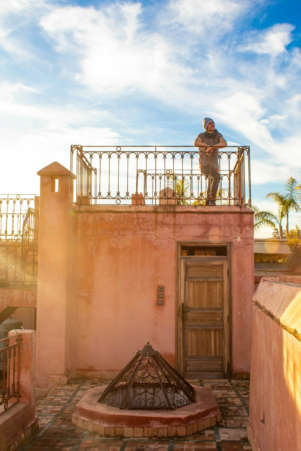 person standing on balcony during daytime