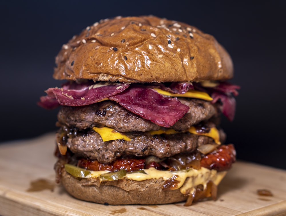 closeup photo of burger on brown surface