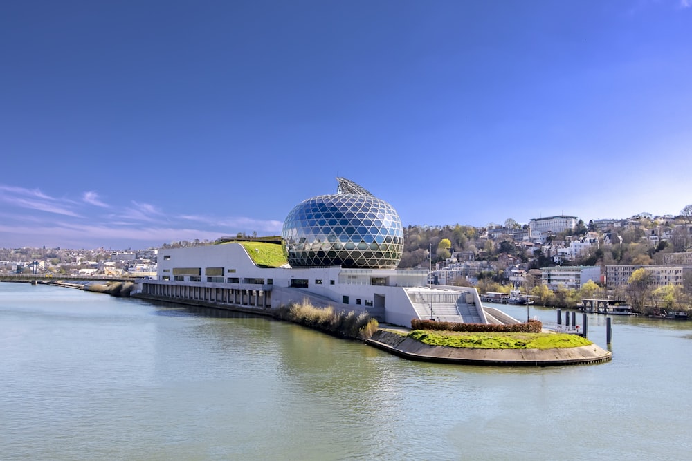 concrete building in the middle of calm water