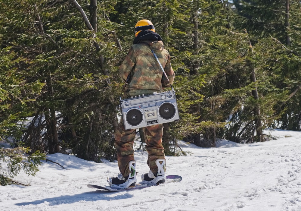 person holding boombox