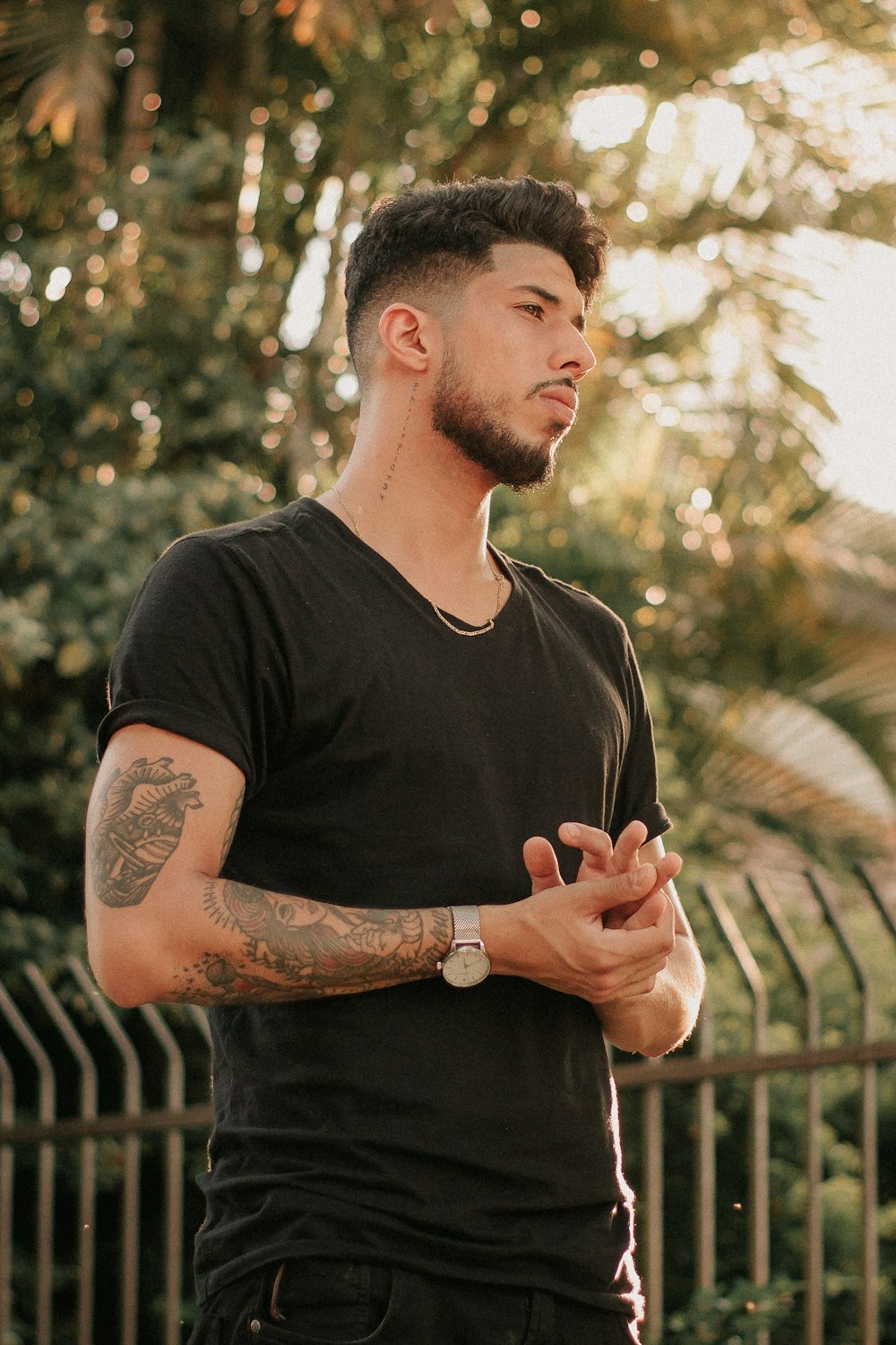 man in black shirt standing on focus photography