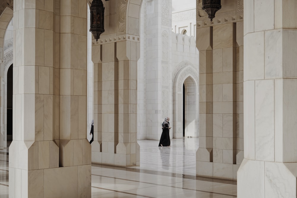 person standing on hallway of building