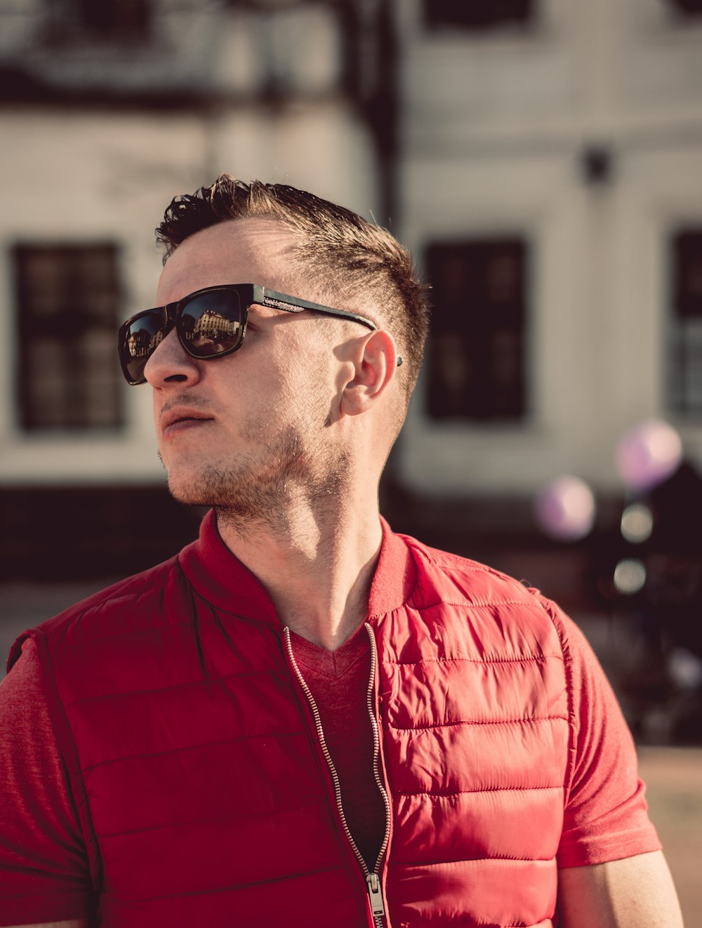 man in red zip-up top