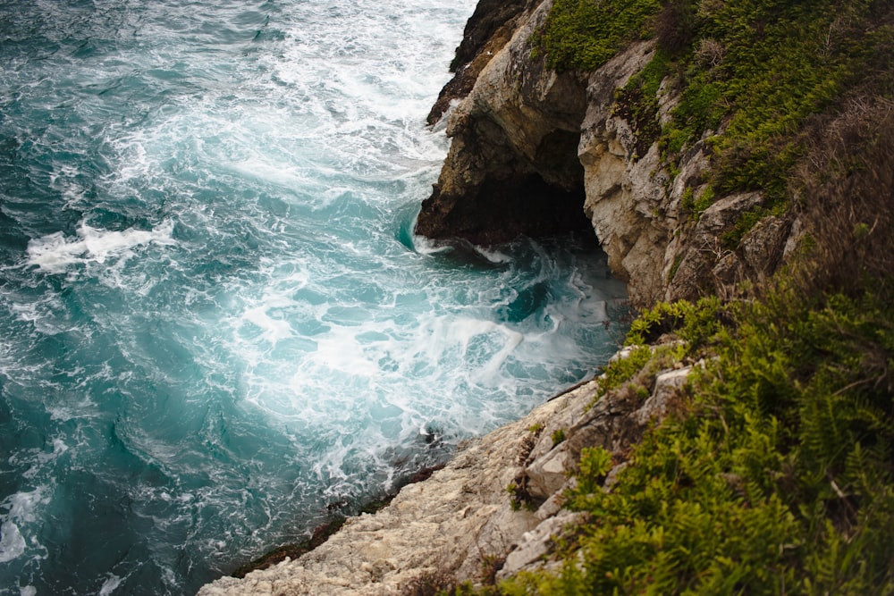 ocean waves beside island