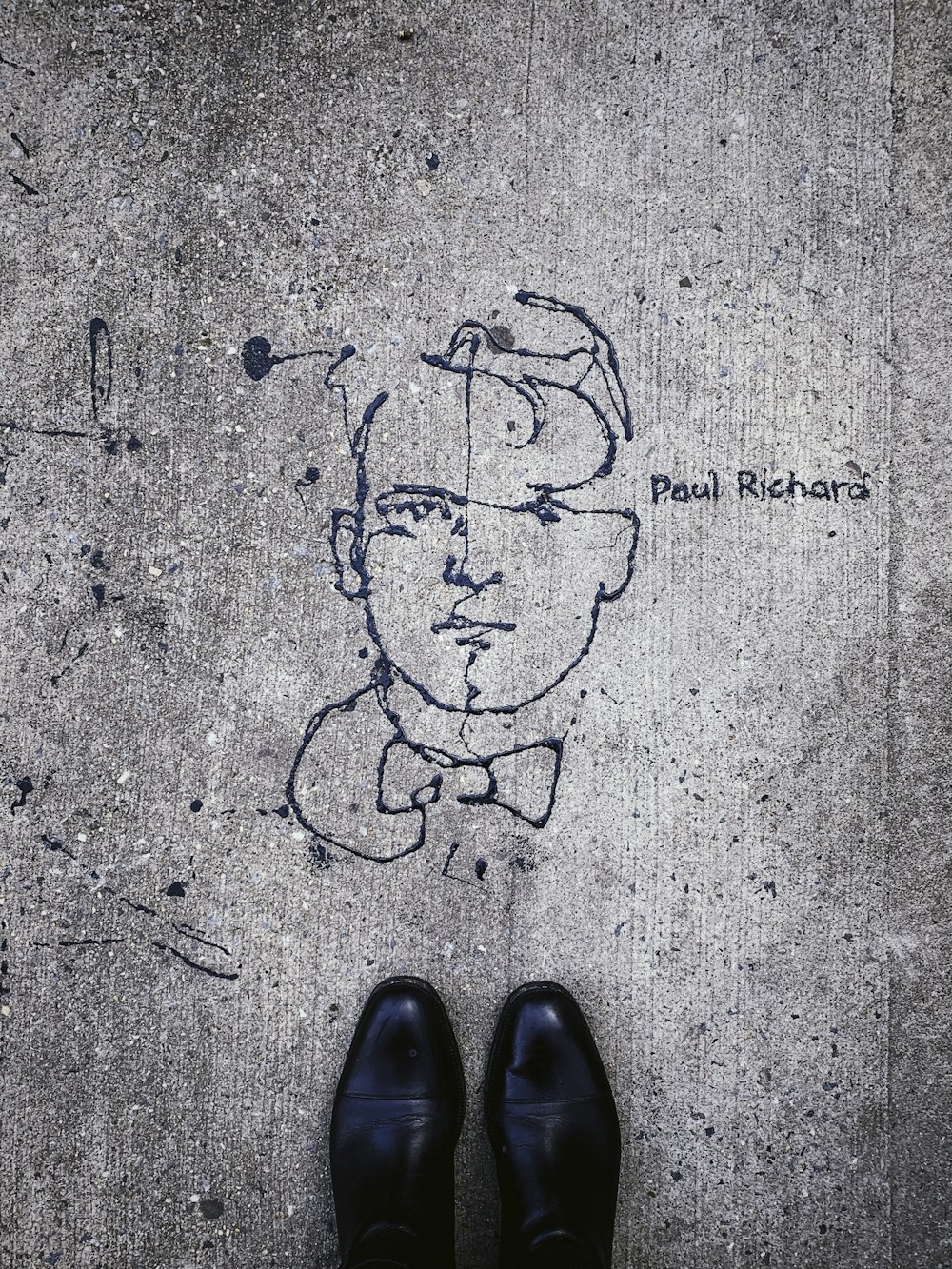 person standing near Paul Richard sketch