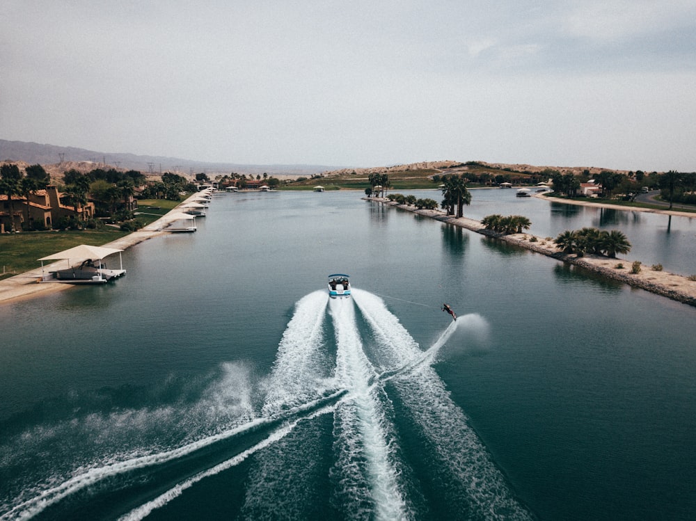 white boat on body of water