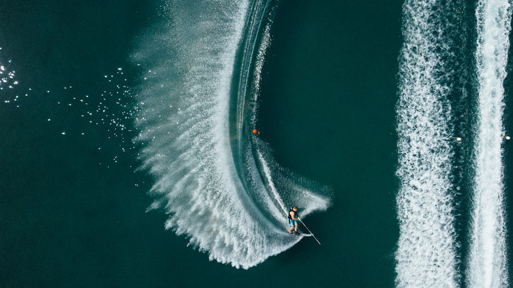 aerial photo of person riding personal watercraft during daytime