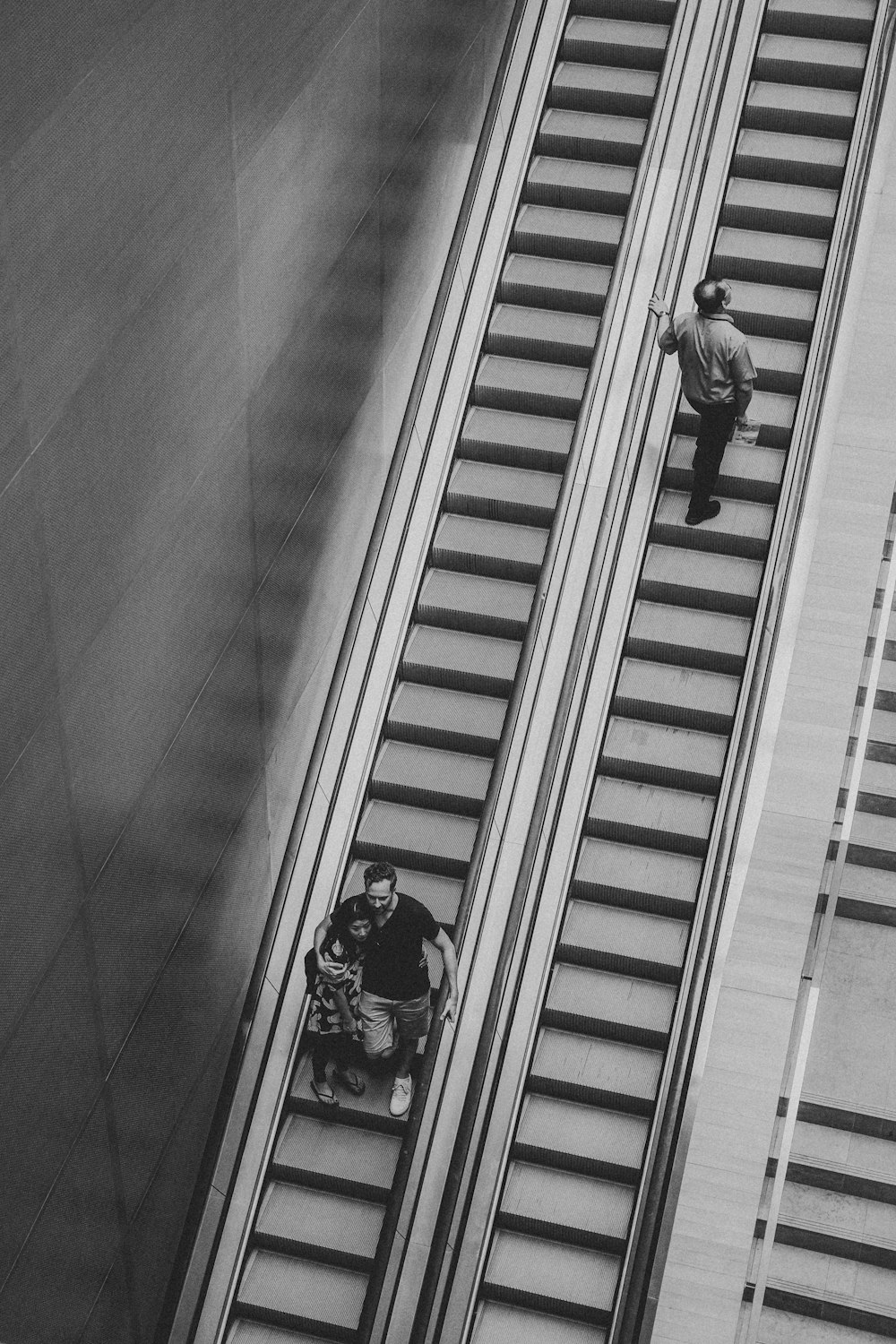 grayscale photo of man on elevator