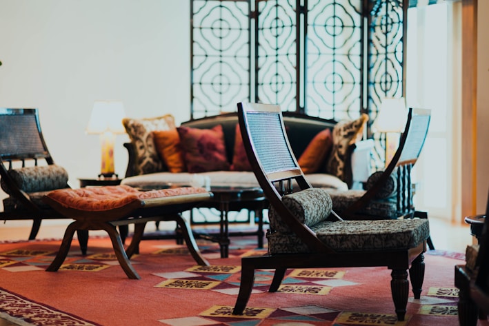 A cozy living room featuring a plush, patterned carpet in warm earth tones.