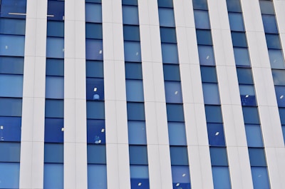 architectural photography of white and blue building