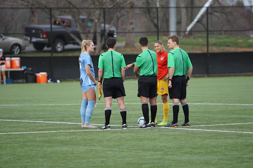 A group of referees attending a training session outdoors in Meta.