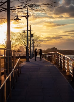 2 people standing on the pathway