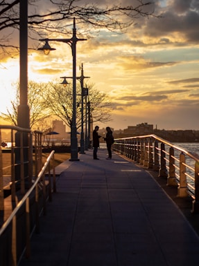 2 people standing on the pathway