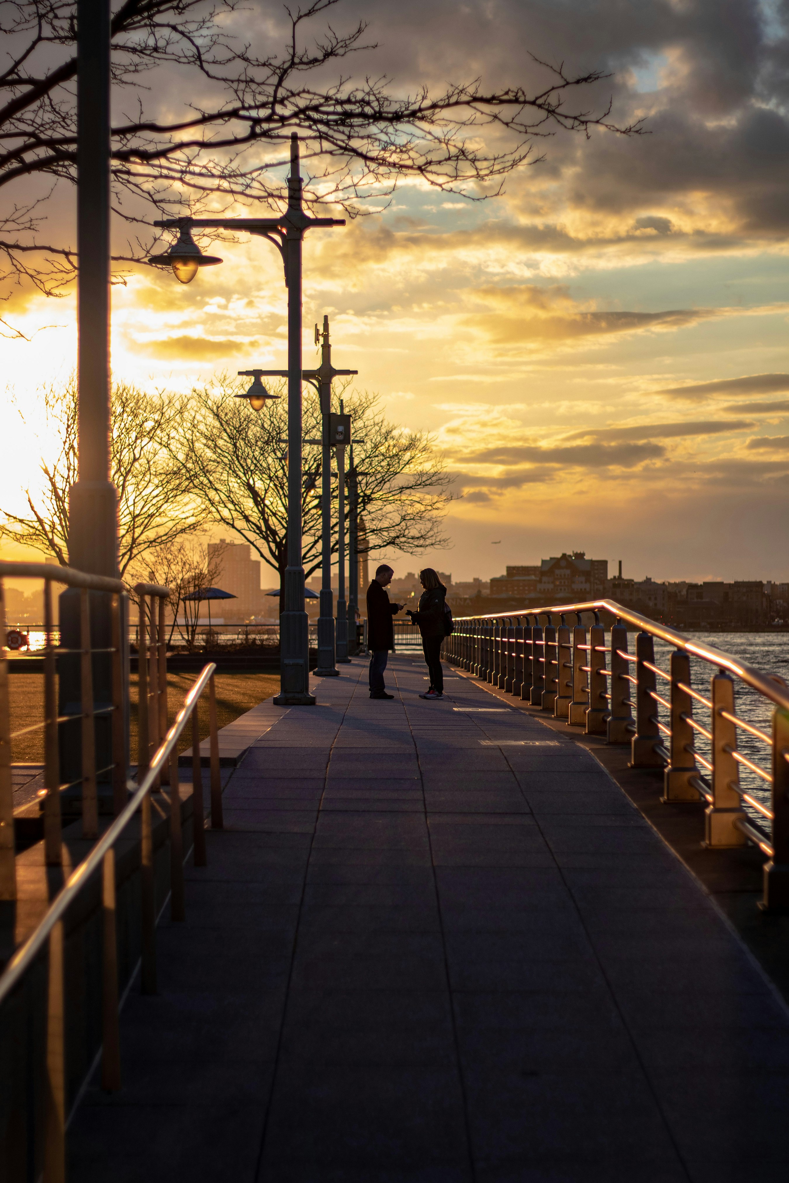 2 people standing on the pathway