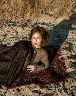 woman wearing brown sweater