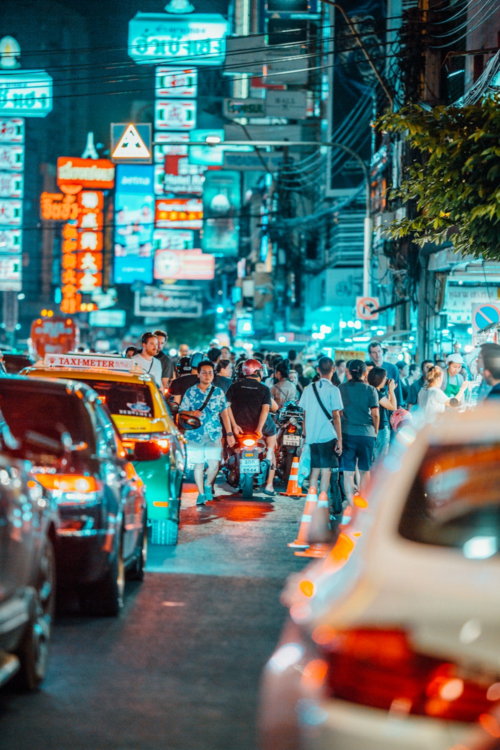 people walking on streets at nighttime