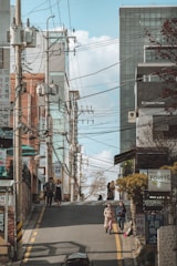 two women walking at road during daytime