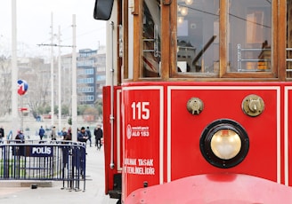 red and brown train during daytime