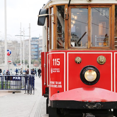 red and brown train during daytime