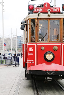 red and brown train during daytime