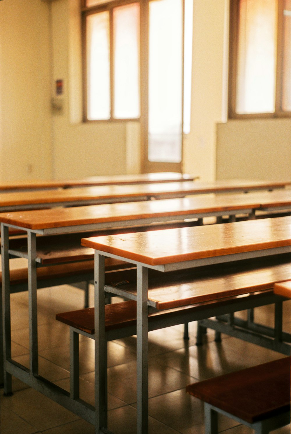 brown and gray wooden tables and chairs