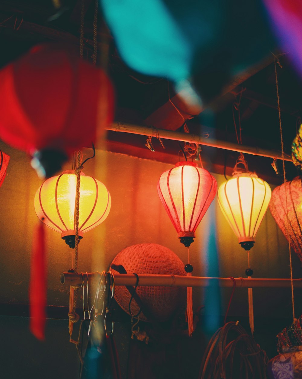 shallow focus photography of red and yellow lanterns