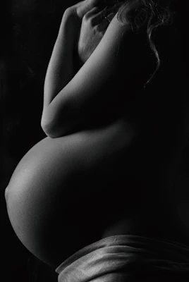 garyscale photography of pregnant woman