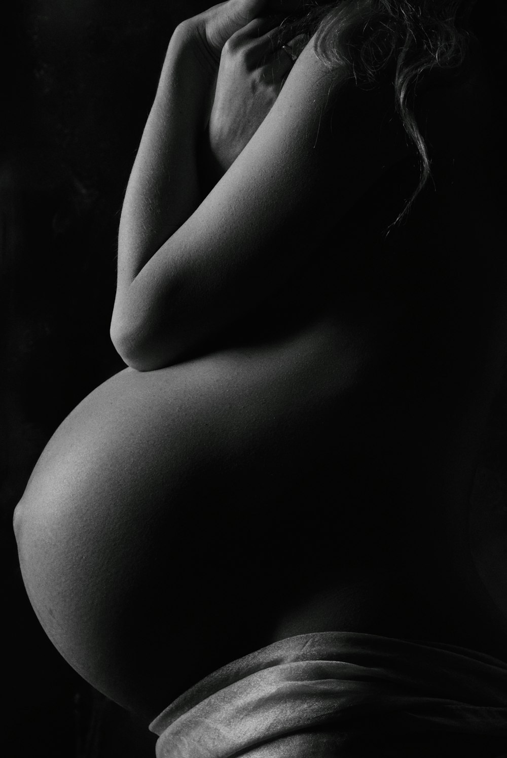 garyscale photography of pregnant woman