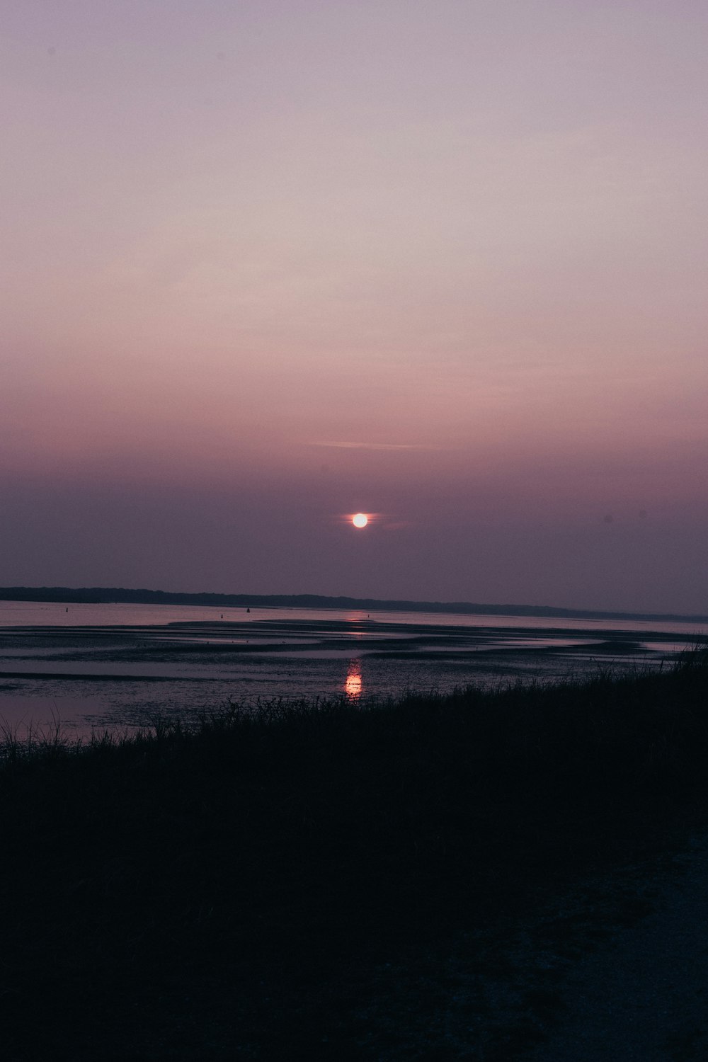 calm body of water under full moon view