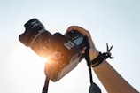 a person holding a camera up to take a picture