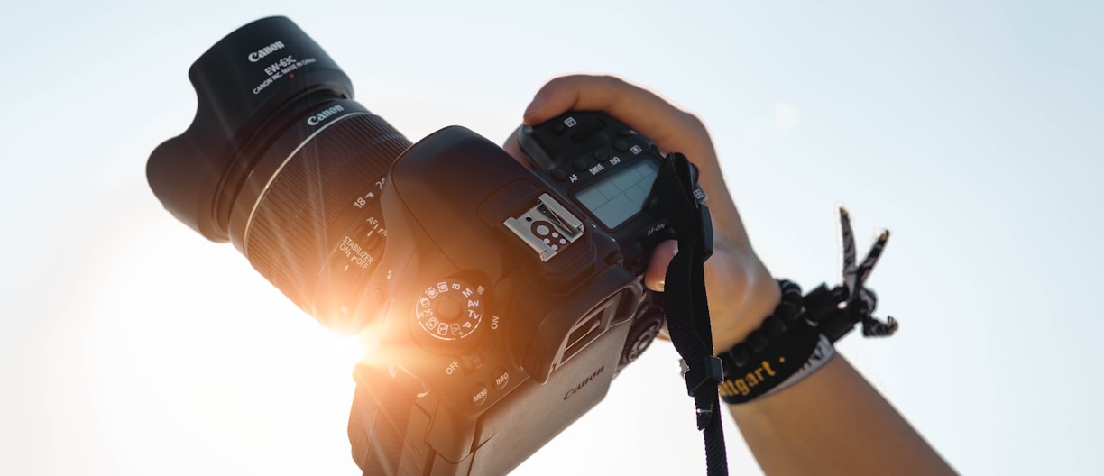 a person holding a camera up to take a picture