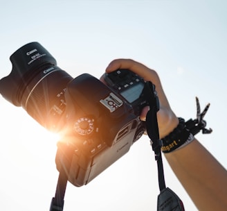 a person holding a camera up to take a picture