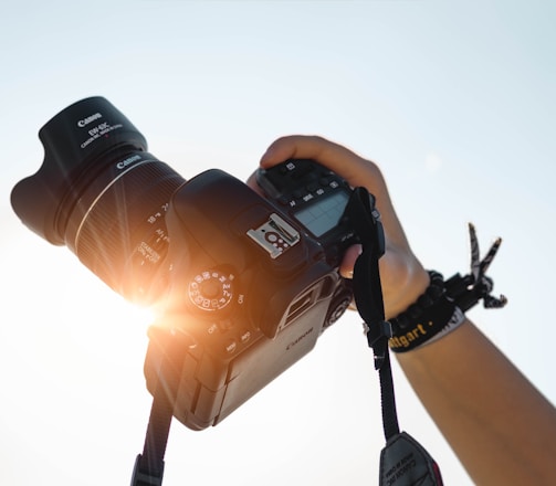 a person holding a camera up to take a picture