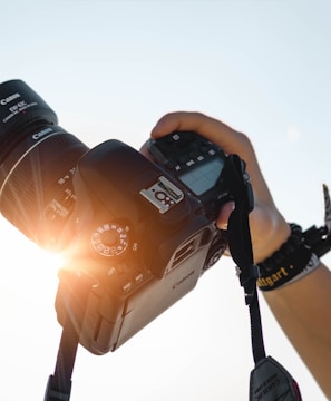 a person holding a camera up to take a picture