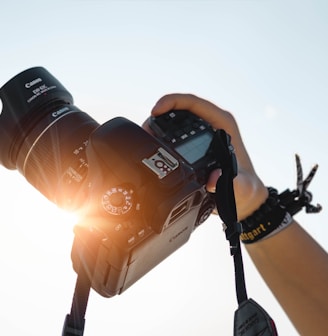 a person holding a camera up to take a picture