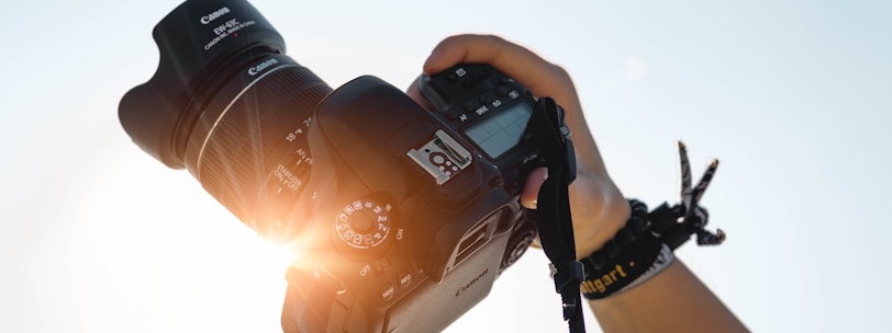 a person holding a camera up to take a picture